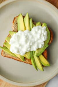 avo toast with cottage cheese on top