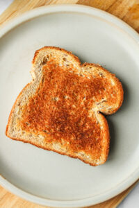 plain toast on top of a grey ceramic plate