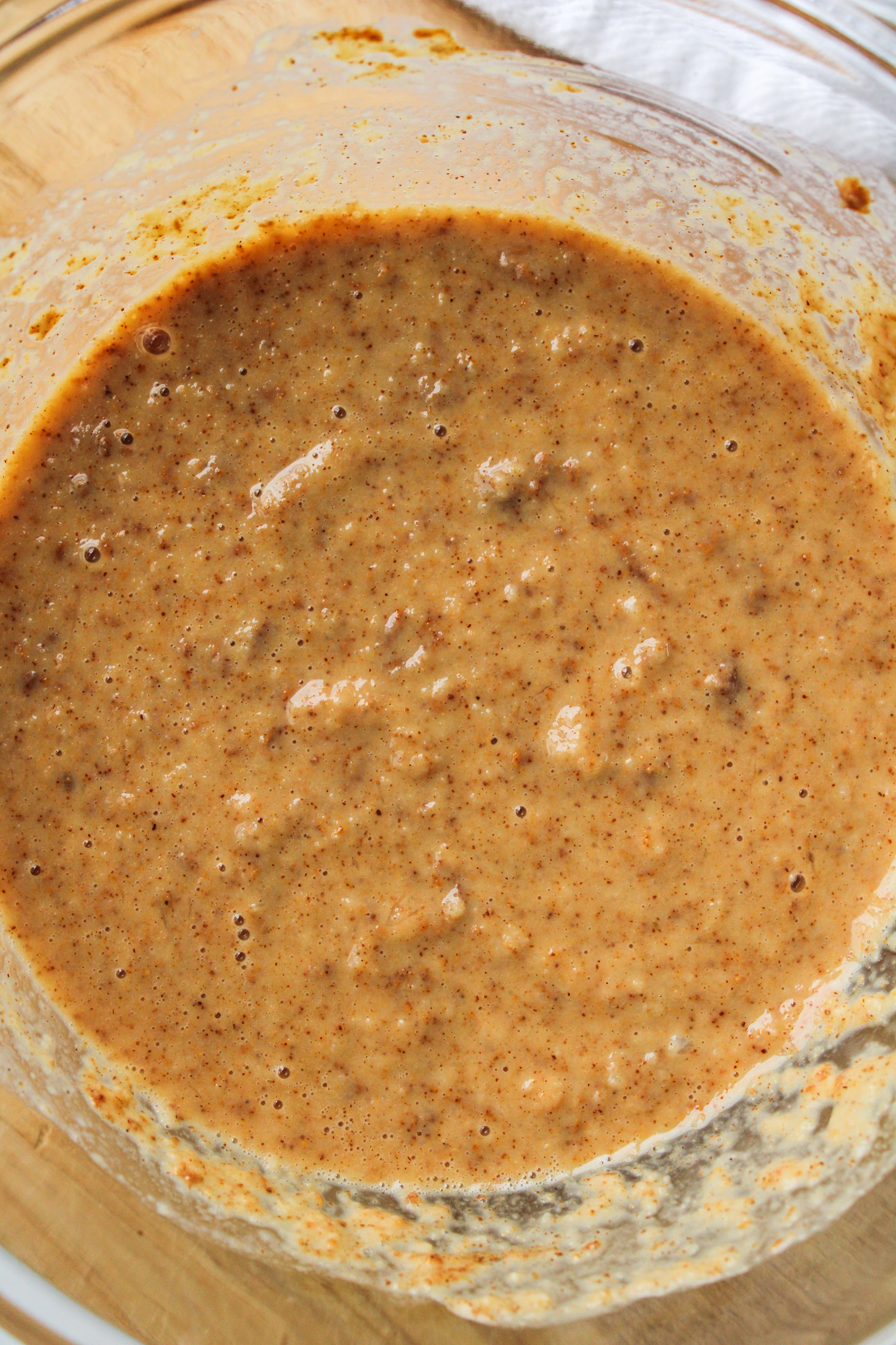 raw batter for apple oat bars in a large glass bowl