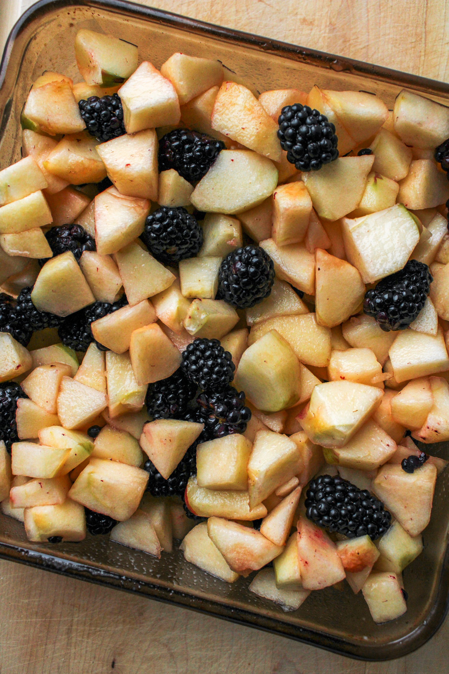 fruit filling mixture in a glass 8x8" baking dish