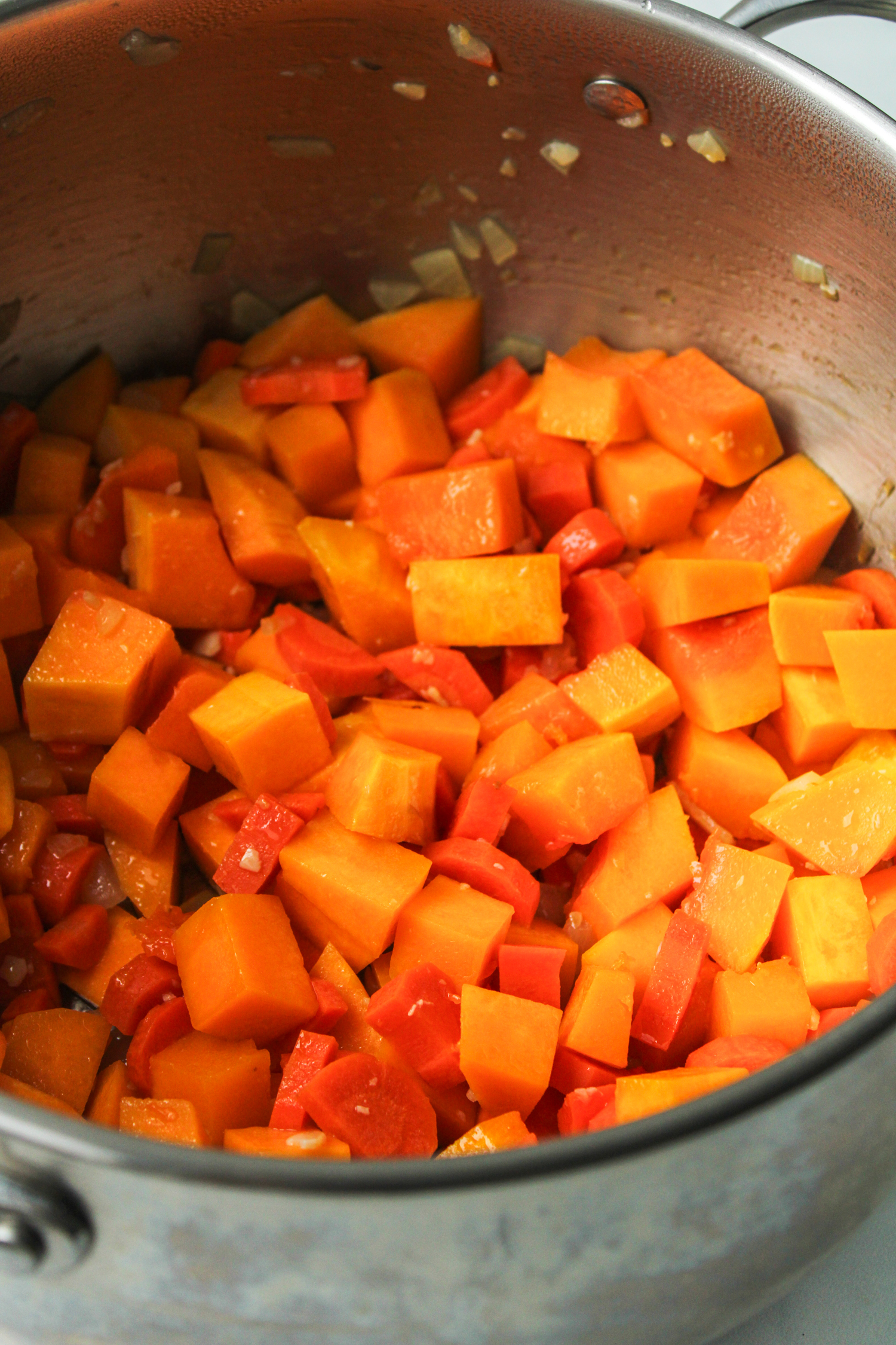 chopped vegetables in a large stainless steel pot