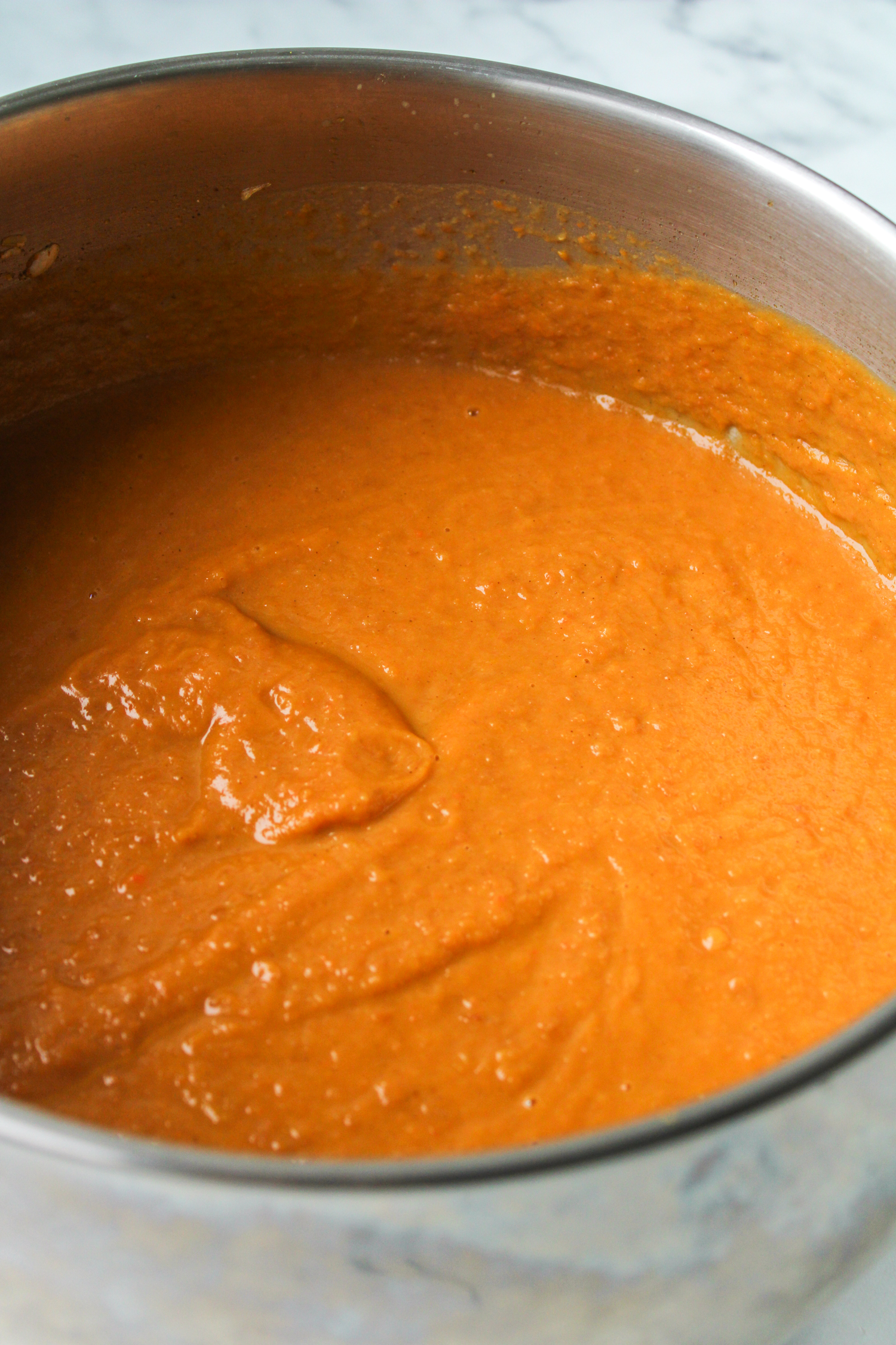 butternut squash soup in a large stainless steel pot