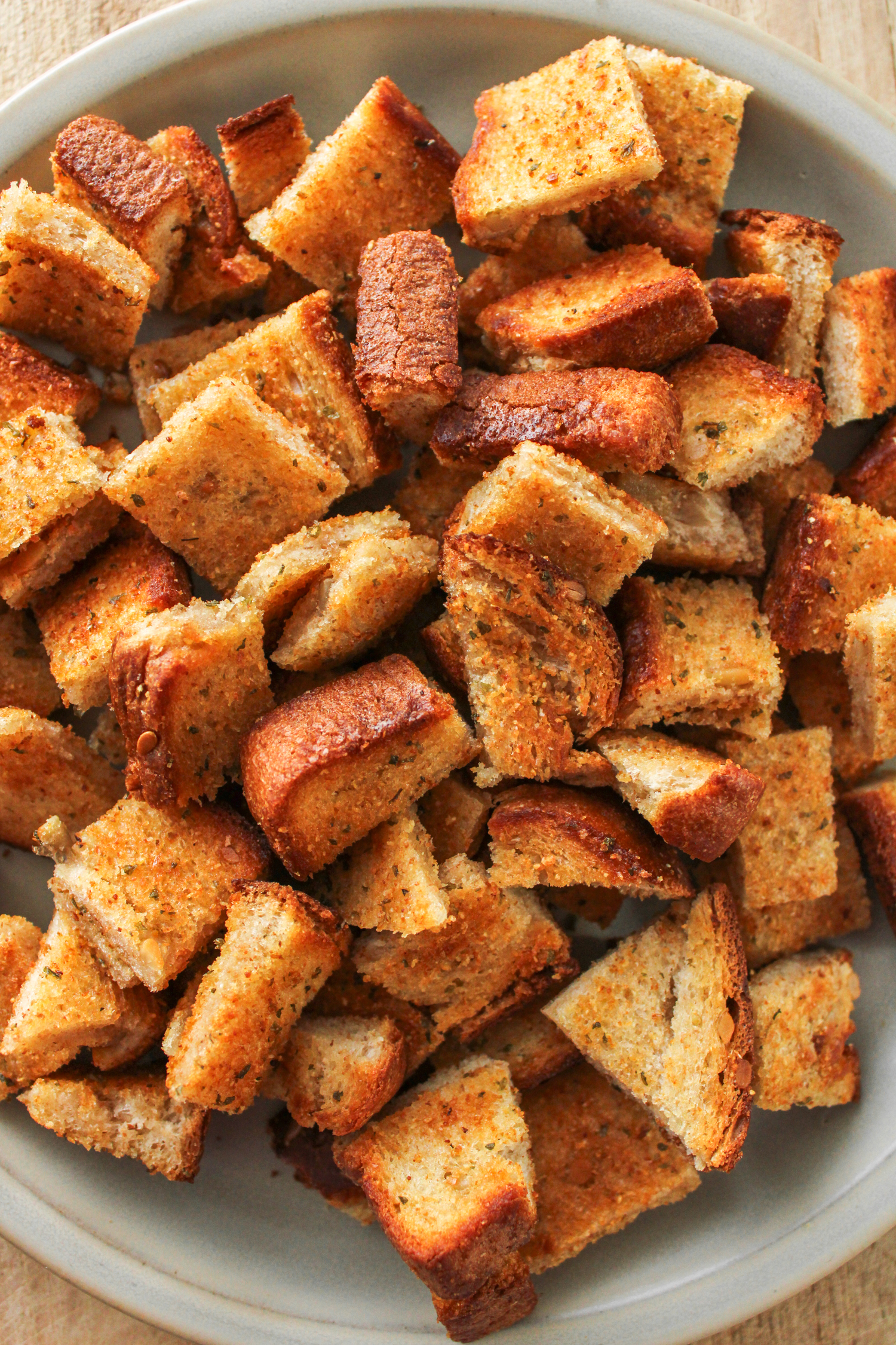 garlic bread bites on a grey ceramic plate