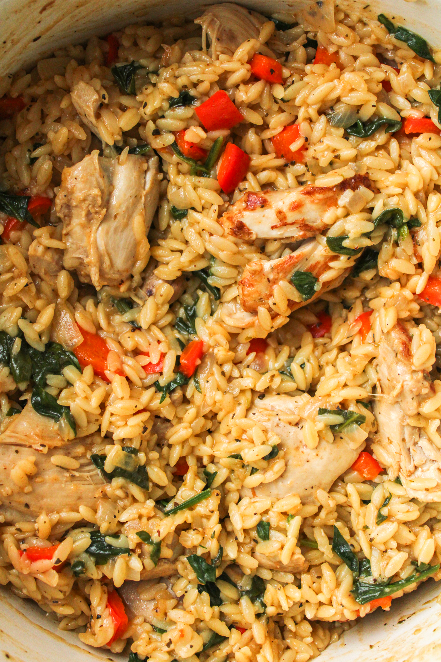 cooked chicken and orzo bake in a large pot