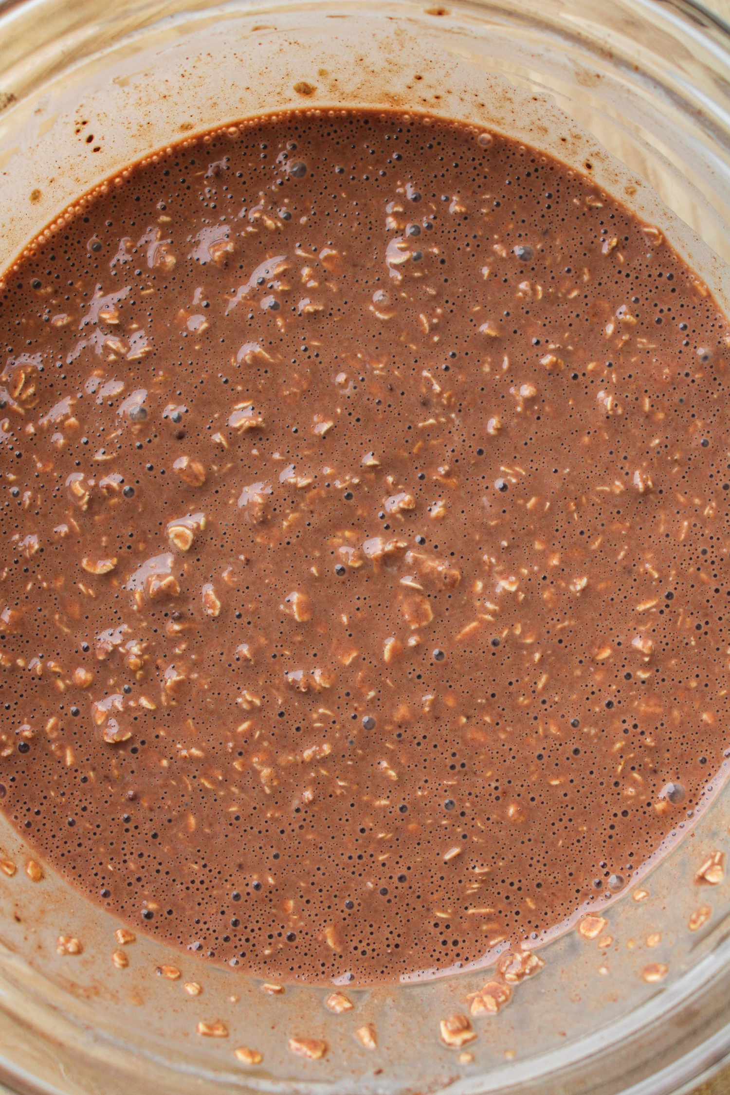 chocolate oats batter mixed together in a large glass bowl