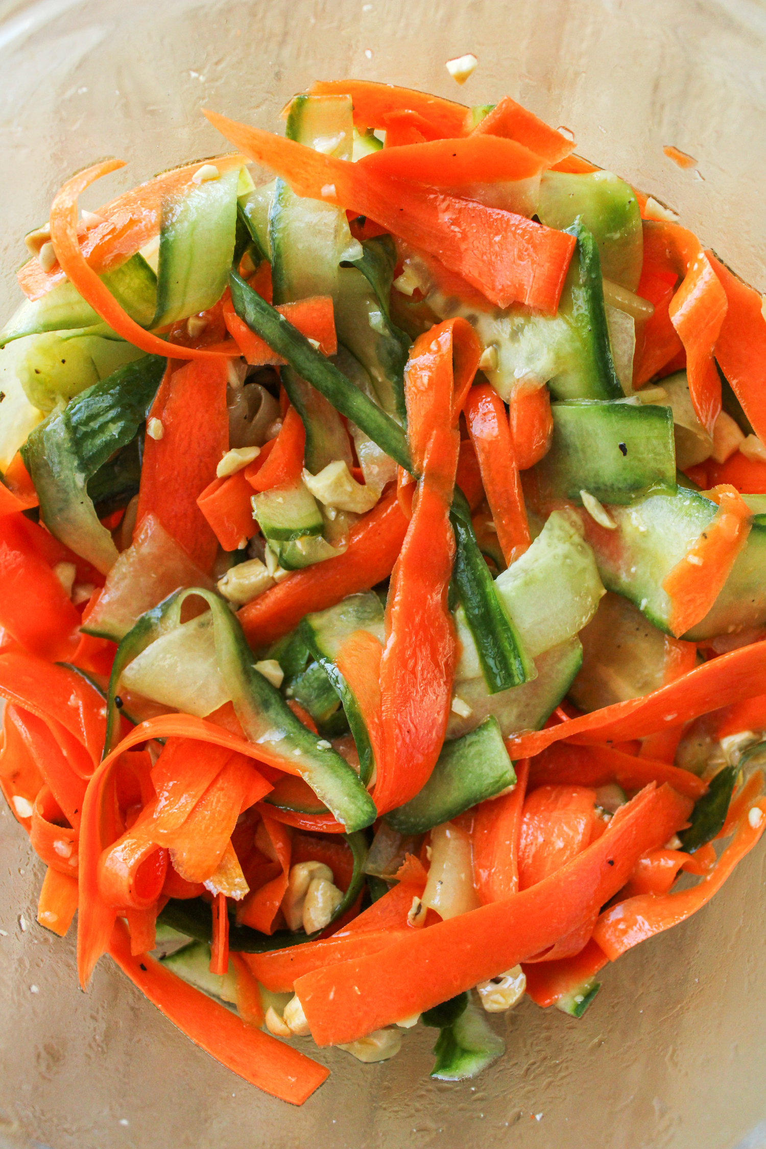 salad with peeled cucumber, carrots and chopped cashews